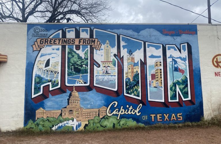 Vintage-looking "Greetings From Austin" postcard mural, originally painted in 1998